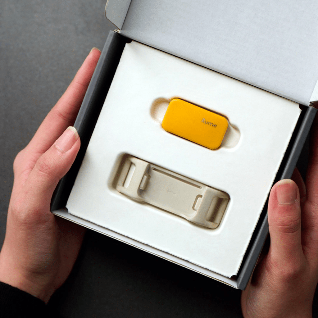 A joyful dog with an Ilume Smart Tracker, exploring the outdoors with seamless tracking