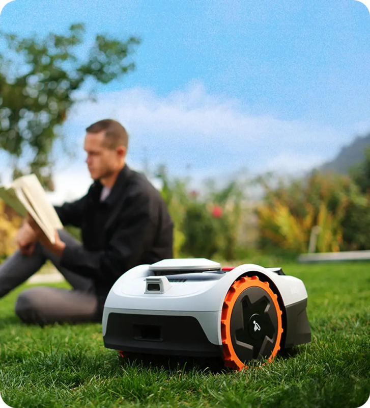 Segway Navimow i Series robotic lawnmower in action on a lush green lawn