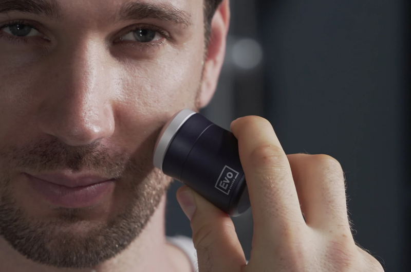 Model using EVO Shaver for grooming with ease