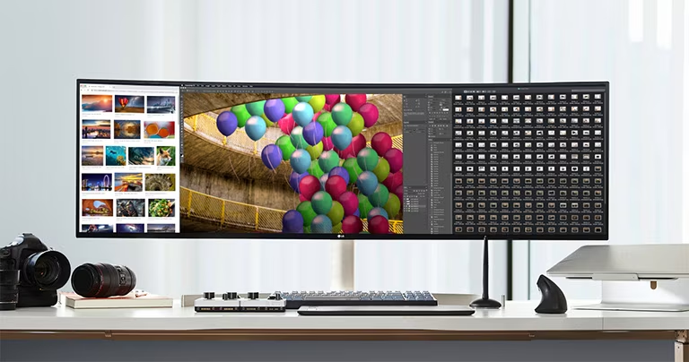 LG 49WL95C-W, a curved dual QHD monitor displaying vibrant visuals