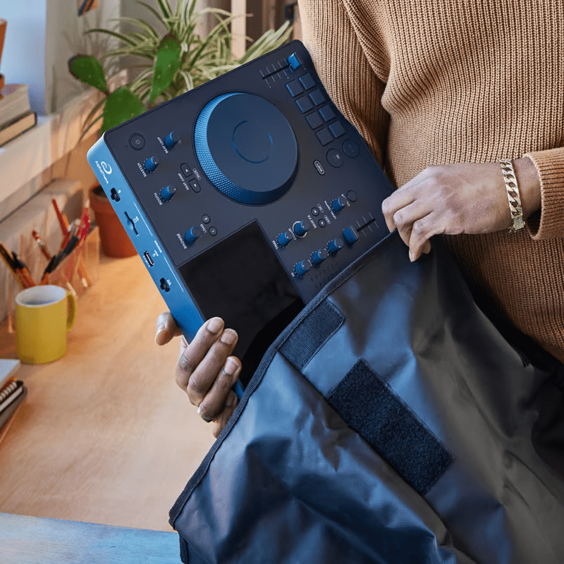 DJ packing the AlphaTheta Omnis-Duo into a protective cover