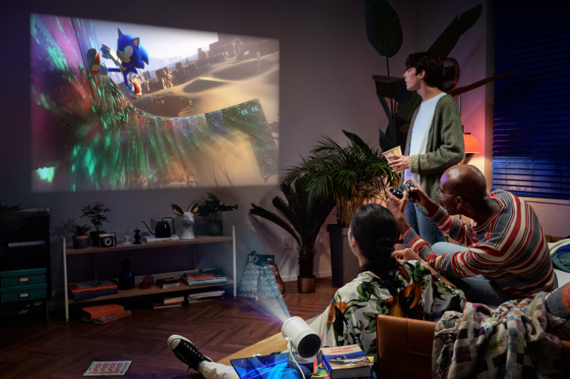 Group of friends playing games using the Samsung Freestyle projector