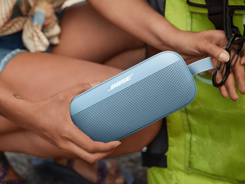 Hands holding the colorful Bose SoundLink Flex speaker