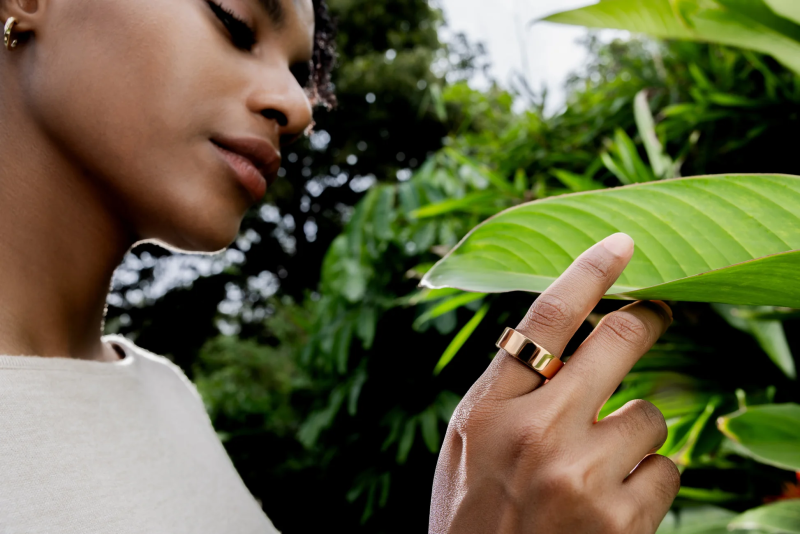 Gold ring being showcased in a lifestyle image with a model