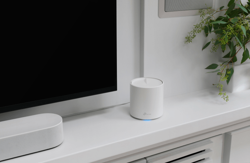 TP-Link Deco AX3000 placed near a smart TV for enhanced connectivity