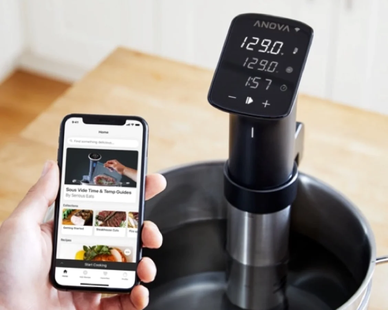 Anova Precision Cooker Pro with smartphone app displayed