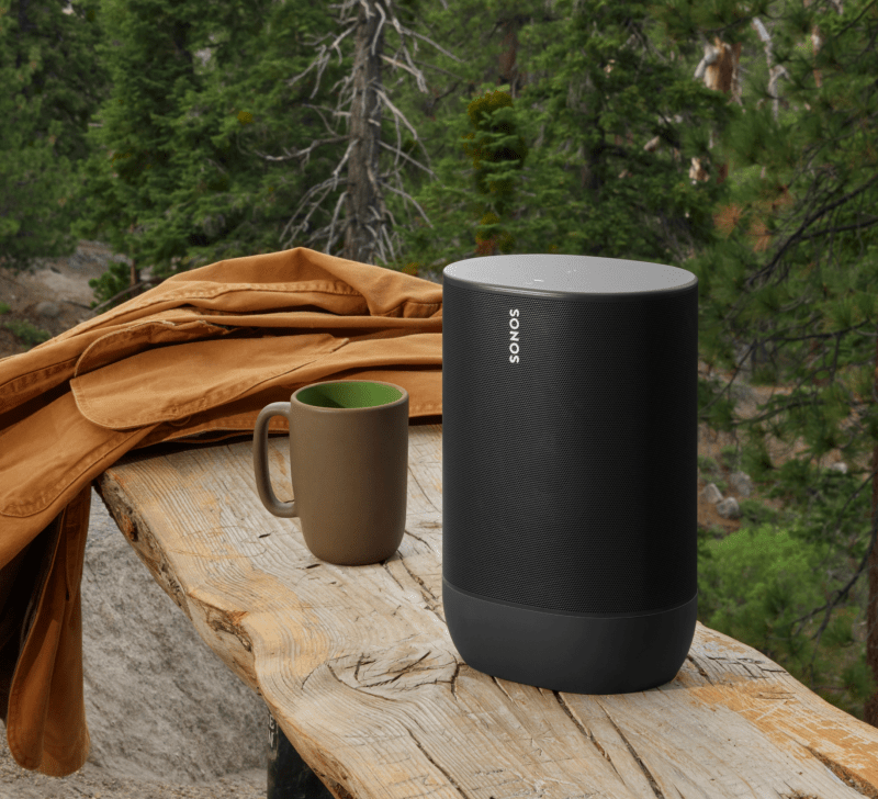 Sonos Move 2 portable speaker placed on outdoor wood seating