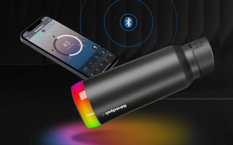 Closeup of Hidrate Spark PRO smart water bottle and app interface