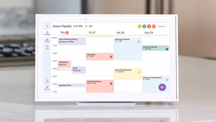 Skylight Calendar placed on a kitchen table, displaying family events and meal plans.