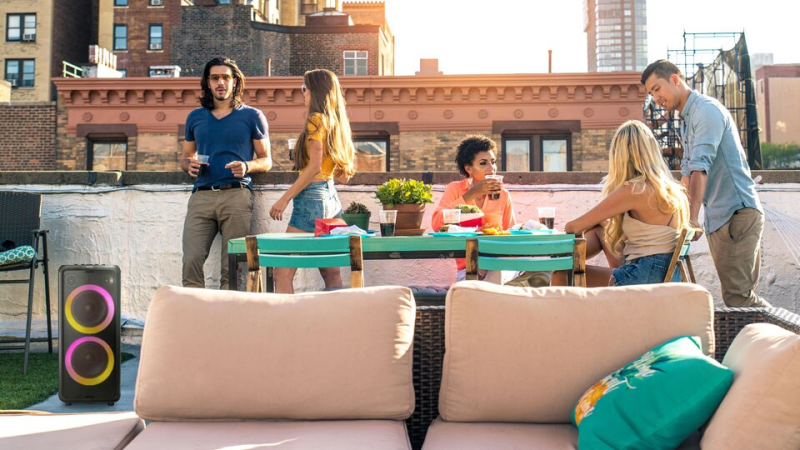 Philips X5206 Party Speaker in a outdoors patio during a family gathering.