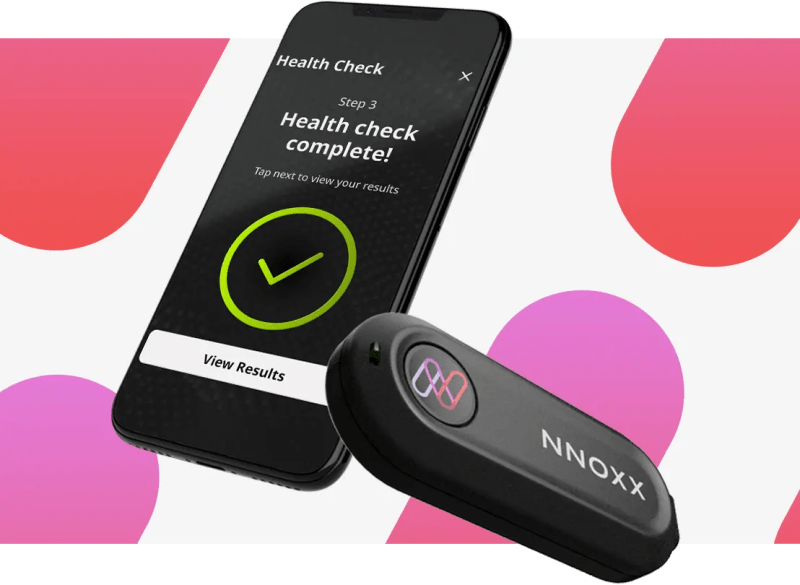 NNOXX-One Wearable Muscle Oxygenation and Nitric Oxide Monitor paired with mobile app showing detailed fitness metrics.