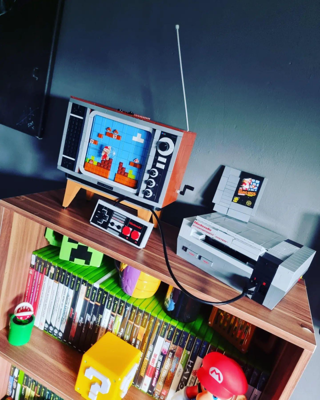 Closeup of the LEGO Nintendo Entertainment System console showing the buildable controller and Game Pak.