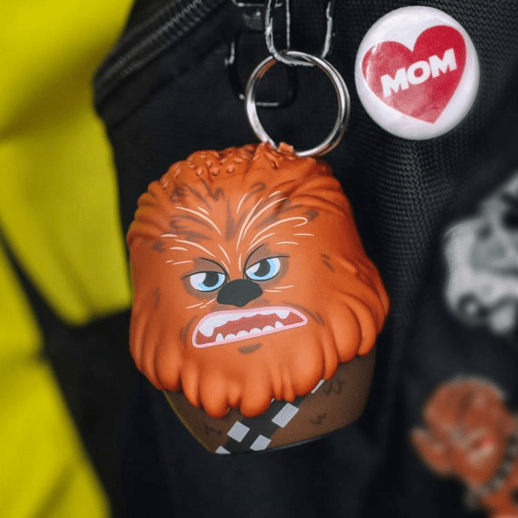 Bitty Boomers Chewbacca speaker attached to a backpack with the included strap, ready for travel.