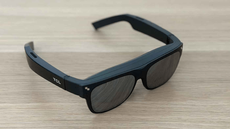 Closeup of TCL NXTWEAR S XR glasses showcasing the dual Micro OLED display and precision-engineered sound components.