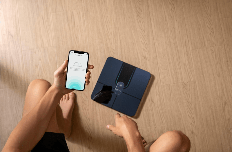 eufy Smart Scale P3 with smartphone displaying body metrics and health stats.