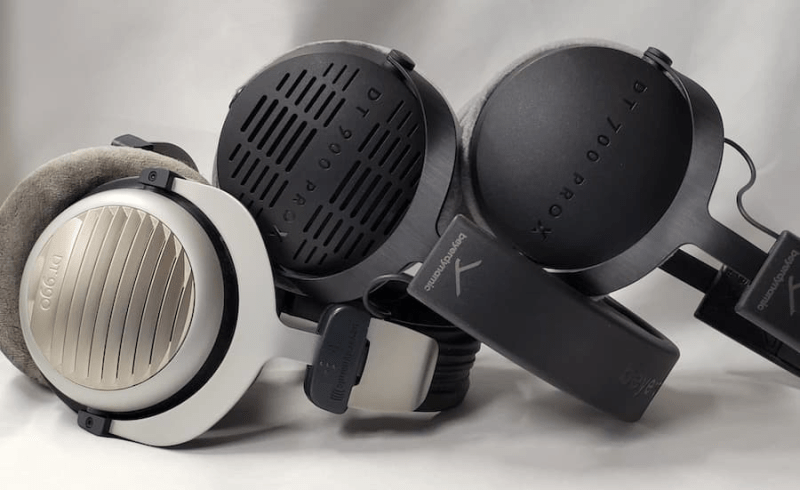 Close-up of Beyerdynamic DT 900 PRO X headphones highlighting memory foam ear pads and reinforced headband