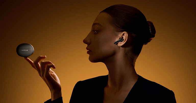 OnePlus Buds Pro 3 on a wireless charger, displaying fast-charging and long battery life.